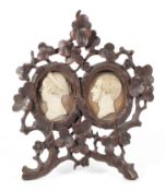 A 19th Century Black Forest style carved easle frame with carved cameo depicting Queen Victoria and