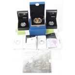 A 2012 silver crown with gold plating, a 2014 Brittania 50p, 4 x silver proof floral £1 coins,