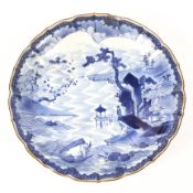 Late 19th century Japanese blue and white charger with fluted rim,