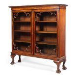 A 19th century mahogany glazed bookcase with corner mouldings to the glaze doors,