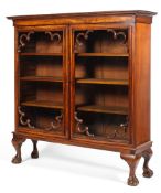 A 19th century mahogany glazed bookcase with corner mouldings to the glaze doors,