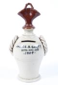 An unusual early 20th century Staffordshire stoneware money box inscribed James B. Gallery, (b.