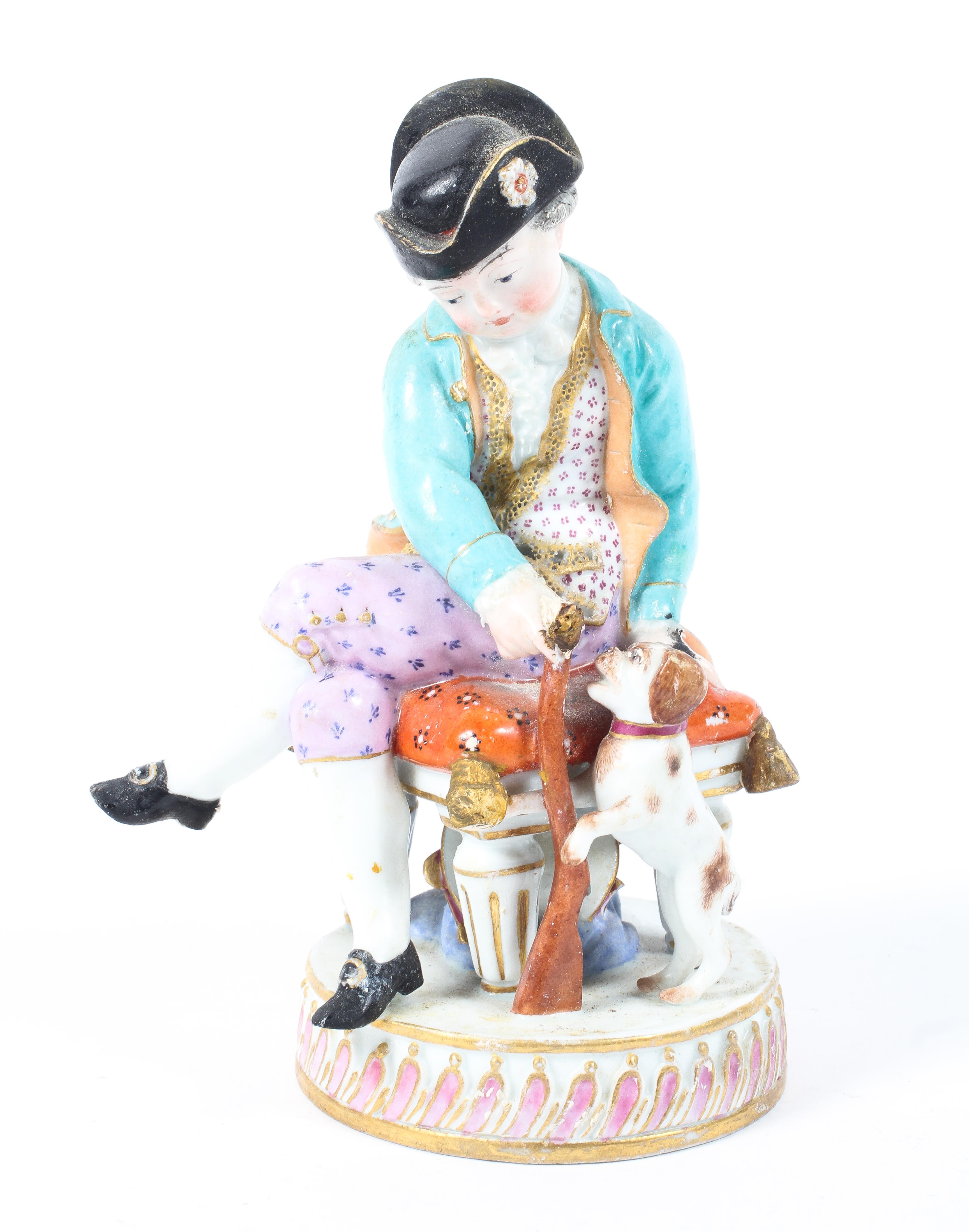 A 19th century Meissen figure, depicting a seated gentleman with his dog,