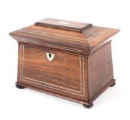 A Regency rosewood inlaid sarcophagus shaped two section tea caddy,