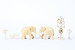 An assortment of late 19th/early 20th century carved ivory including, a pair of elephants,