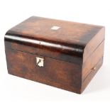 A Victorian ladies walnut dressing box with mother of pearl inlay the rising lid to a fitted