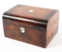 A Victorian ladies walnut dressing box with mother of pearl inlay the rising lid to a fitted