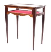 An Edwardian inlaid mahogany bijouterie display table raised on square tapering supports,