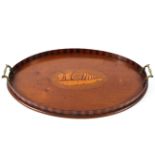 An Edwardian mahogany twin handled tray with a two tone gallery and inlaid shell to the centre 58cm