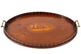 An Edwardian mahogany twin handled tray with a two tone gallery and inlaid shell to the centre 58cm