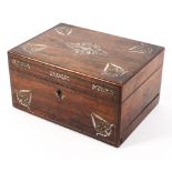 A 19th Century rosewood ladies traveling dressing chest inlaid with mother of pearl and red velvet