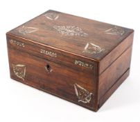 A 19th Century rosewood ladies traveling dressing chest inlaid with mother of pearl and red velvet