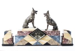 An Art Deco German made marble clock garniture comprising of a clock surmounted by two seated