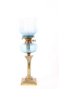 An Edwardian blue glass and brass mounted oil lamp,