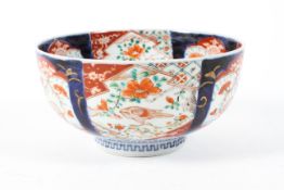 A 19th/20th century Japanese imari bowl decorated with reserves of birds and foliage,