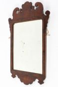 A Georgian mahogany framed fretwork mirror, with original glass,