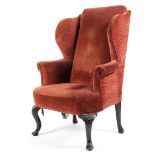 A Georgian style wing back elbow chair, with outswept arms,