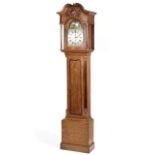 A 19th century oak 8 day longcase clock with open swan neck pediment,