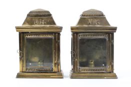 A pair of brass exterior door lamps with VR monogram, each of stepped rectangular form,