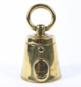 A 19th century brass ink well, in the form of a hand held 4Ib weight, with liner, 8.