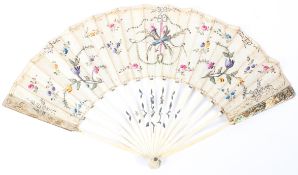 A late 18th-early 19th century folding fan, the fabric decorated with painted flowers,