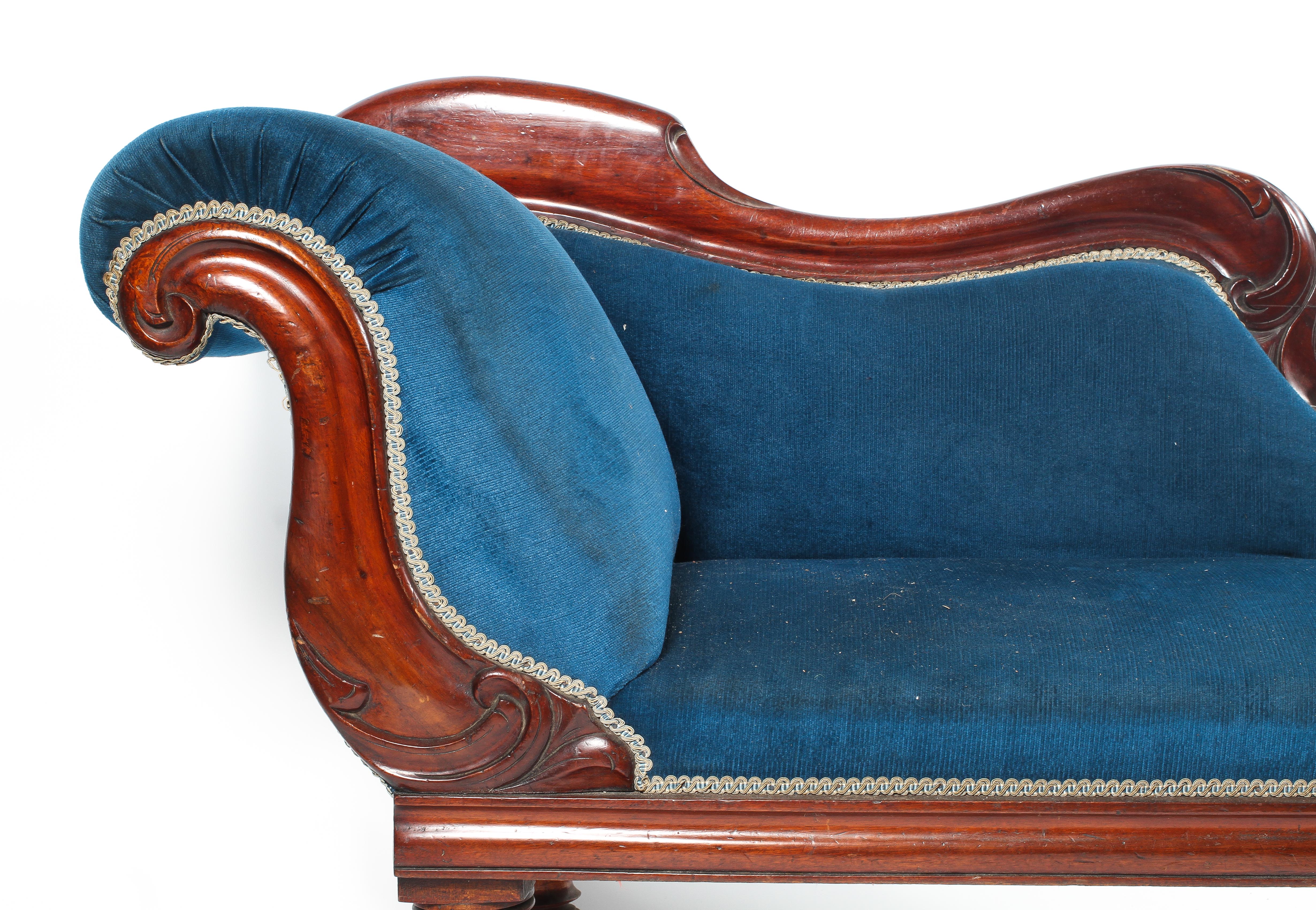 A Victorian mahogany framed chaise lounge re-upholstered with arched side panel raised on turned - Image 2 of 2