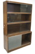 A set of teak library shelves,