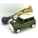 A model of a mini and a car horn, the car in green with a cream roof, length 30cm,