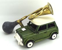 A model of a mini and a car horn, the car in green with a cream roof, length 30cm,