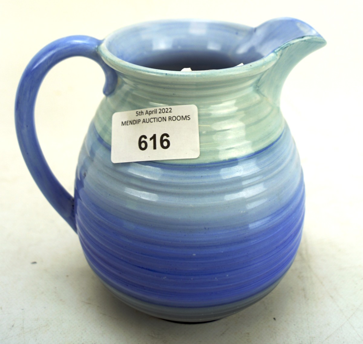 A Shelley jug, decorated with graduating blue design,