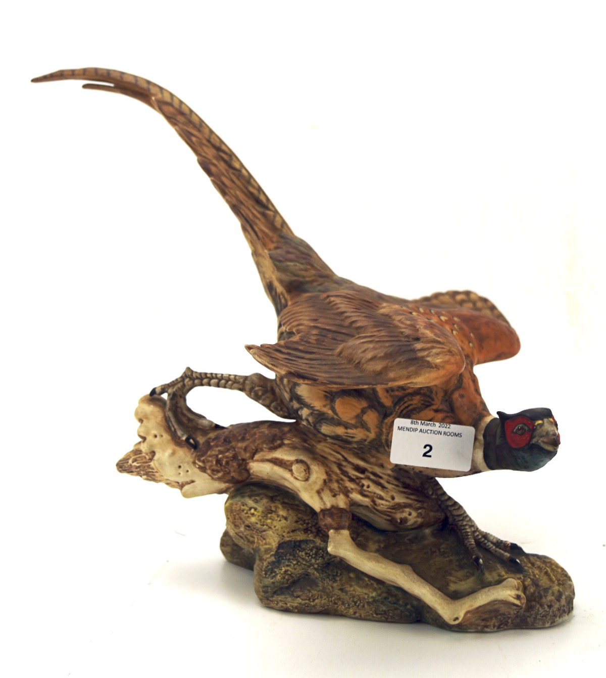 A Beswick model of a pheasant, in a naturalistic pose,