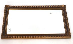 A contemporary bevelled edge gilt framed wall mirror with a moulded framed,