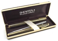 A pair of Sheaffer pens, one being a 14k nibbed fountain pen, in original box,
