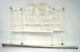 A cast iron white painted 4ft bed frame,