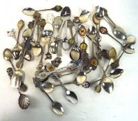 A large selection of vintage commemorative teaspoons