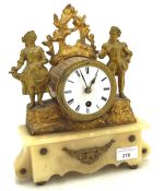 A late 19th century gilt metal mantle clock, mounted on stone base,