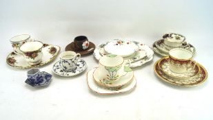 An assortment of trio's cups and saucers,