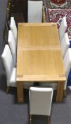 A Marks and Spencer extendable dining table and and eight chairs,