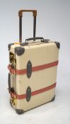 A Globe Trotter carry on two wheel suitcase,