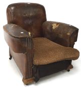 An early 20th century leather armchair,