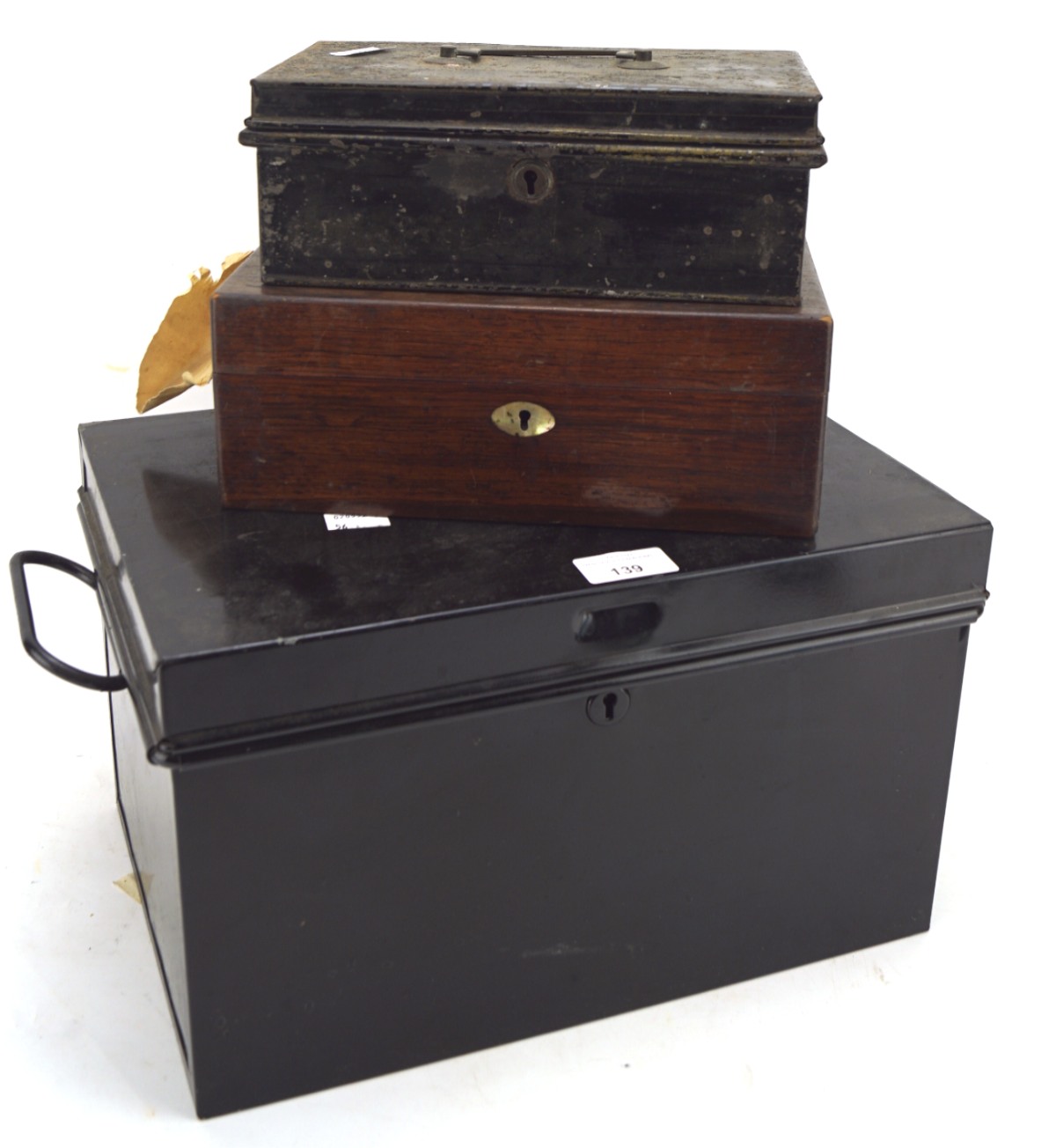 Two tin trunks and a wooden box, both frunks with hinged lids, one with handles to either side,