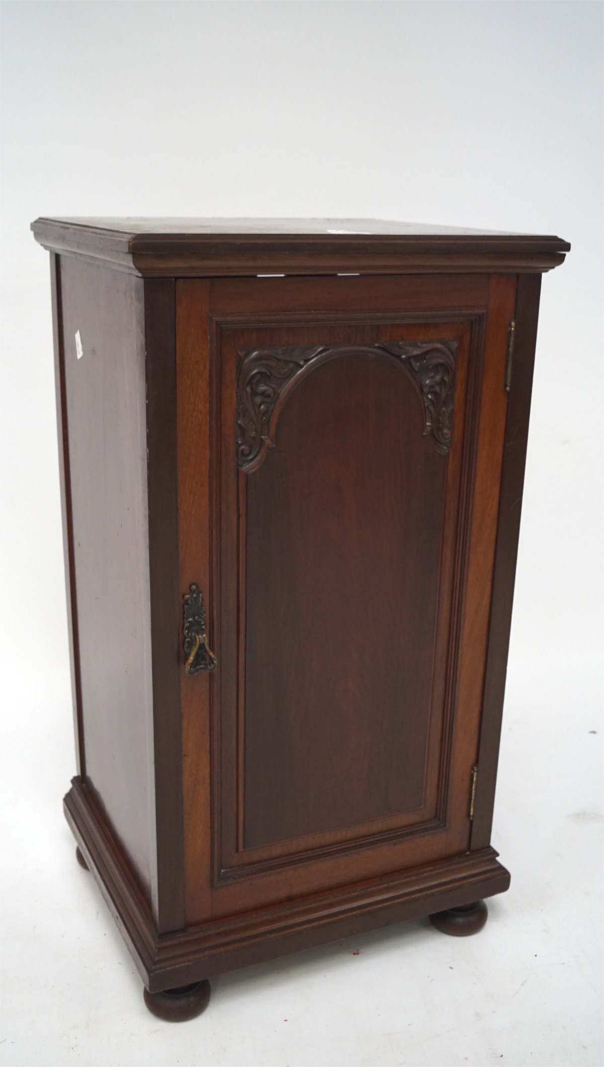 A 20th century hard wood pot cupboard, the single door opening to reveal two shelves,