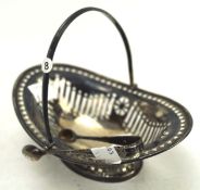 A Victorian silver pierced oval bowl with loop handle,