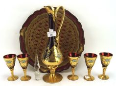 A red glass five piece decanter set, all pieces with gilt decoration,