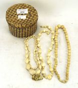 A carved ivory netsuke and three ivory bead necklaces,