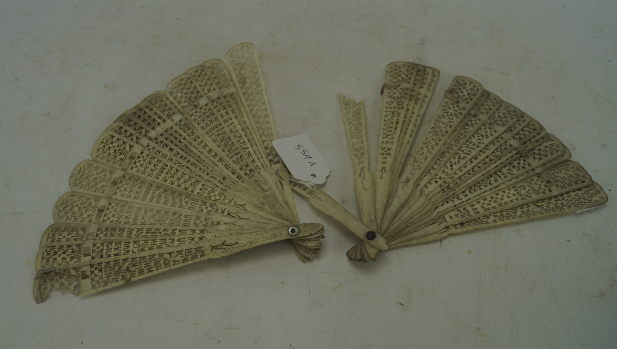 Two 19th century bone briese fans, both with pierced details, length of guards 19.