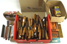 A large collection of vintage and contemporary carving tools and a selection of sharpening stones