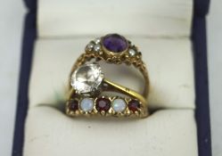 Three gold and stone set rings