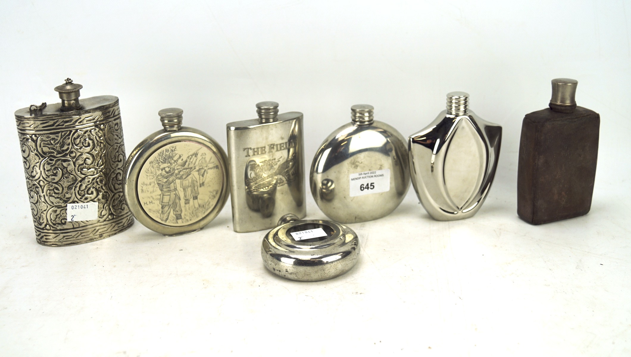 A collection of metal hip flasks, of assorted shapes and designs,