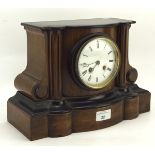 An Edwardian mantel clock, the white enamel dial with Roman numerals,